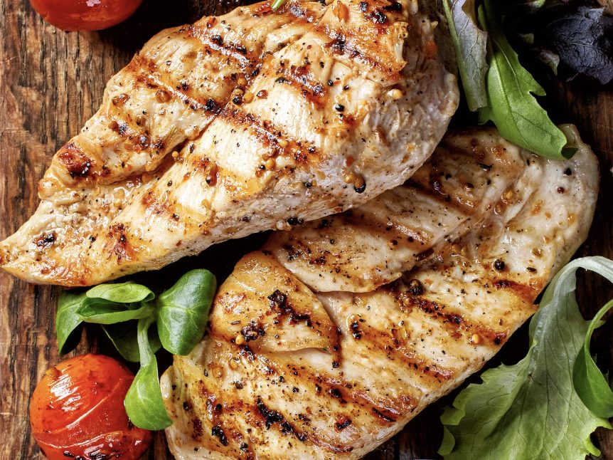 Grilled chicken breasts with grill marks