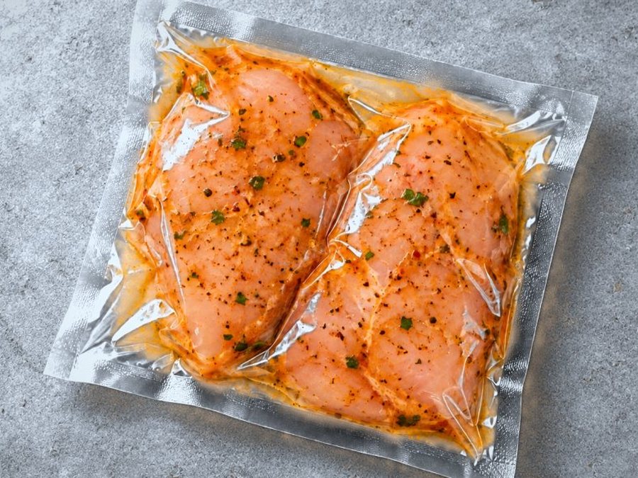Marinated chicken breasts in a vacuum-sealed pack