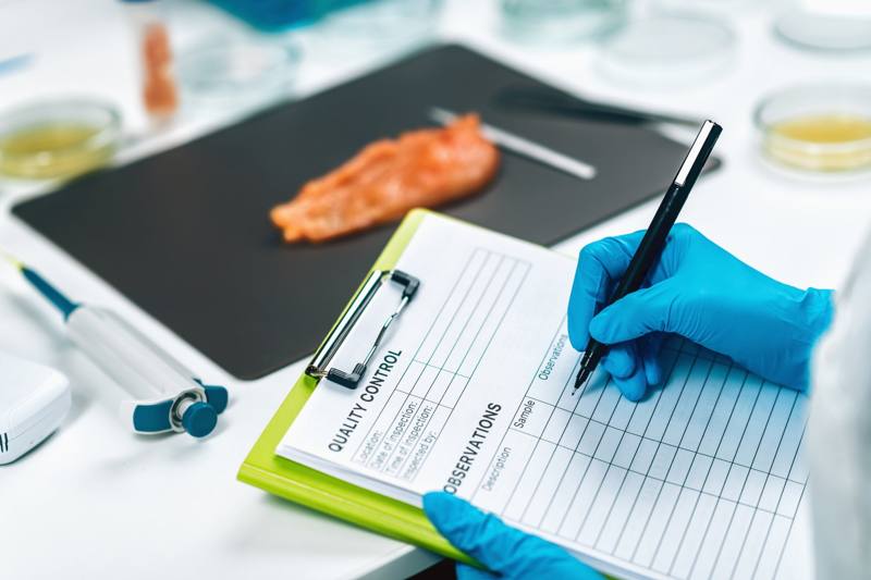 Quality control inspection sheet beside a product sample